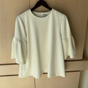 Cream Bell-Sleeve Blouse with Flared Hem